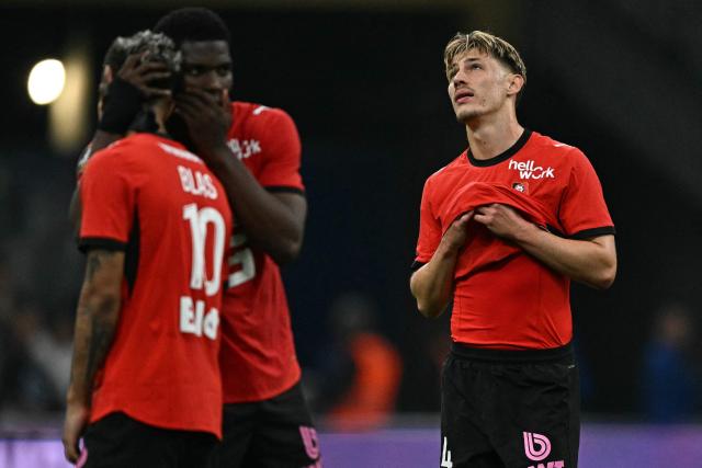 Rennes' French defender #24 Anthony Rouault (R) reacts at the end of the the French L1 football match between Olympique de Marseille (OM) and Stade Rennais FC at the Stade Velodrome in Marseille, southern France, on May 17, 2026. (Photo by Gabriel BOUYS / AFP)