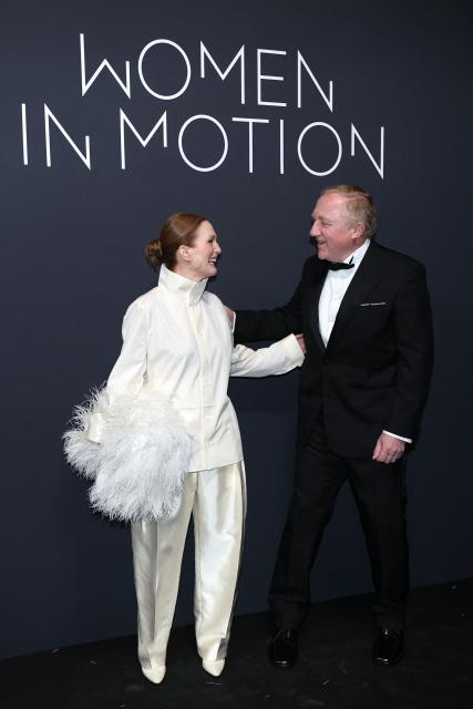 US actress Julianne Moore and French businessman Francois-Henri Pinault attend the 2026 Kering Women in Motion Awards on the sidelines of of the 79th edition of the Cannes Film Festival in Cannes, southern France, on May 17, 2026. (Photo by Sameer AL-DOUMY / AFP)