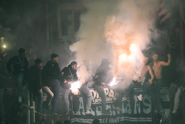 Le Havre's supporters celebrate their team's victory at the end of the French L1 football match between FC Lorient and Le Havre AC at the Stade du Moustoir in Lorient, western France, on May 17, 2026. (Photo by Loic VENANCE / AFP)