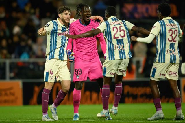9From L) Le Havre's French defender #04 Gautier Lloris, Le Havre's Senegalese goalkeeper #99 Mory Diaw, Le Havre's Tanzanian forward #25 Mbwana Samatta and Le Havre's French defender #32 Timothee Pembele celebrate after winning the French L1 football match between FC Lorient and Le Havre AC at the Stade du Moustoir in Lorient, western France, on May 17, 2026. (Photo by Loic VENANCE / AFP)