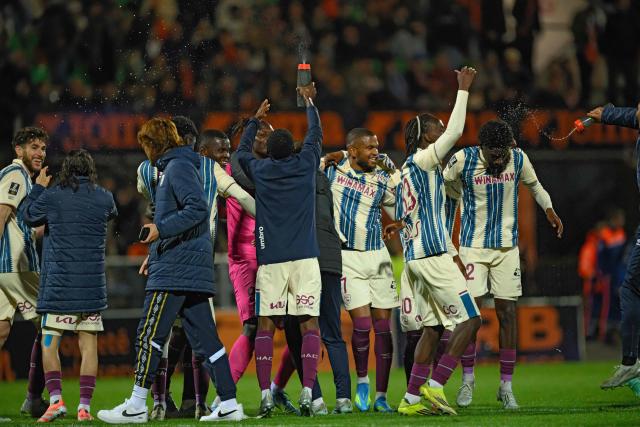Le Havre's players celebrates after winning the French L1 football match between FC Lorient and Le Havre Athletic Club at Yves-Allainmat stadium in Lorient, western France on May 17, 2026. (Photo by Loic VENANCE / AFP)