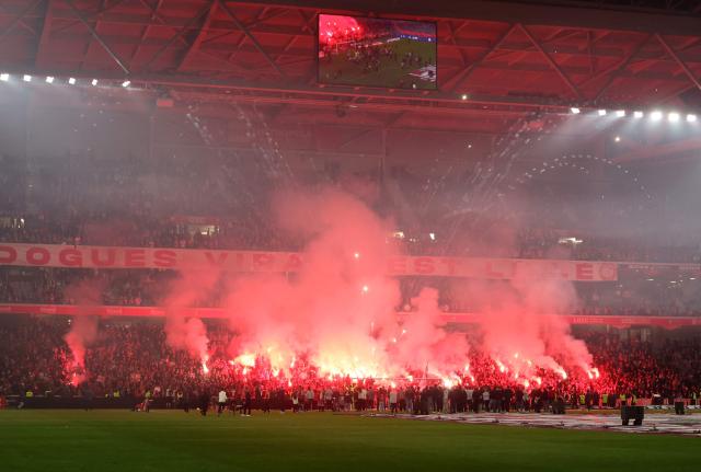 Lille players celebrate with supporters following the French L1 football match between Lille LOSC and AJ Auxerre at the Stade Pierre-Mauroy in Villeneuve-d'Ascq, northern France on May 17, 2026. (Photo by Francois LO PRESTI / AFP)