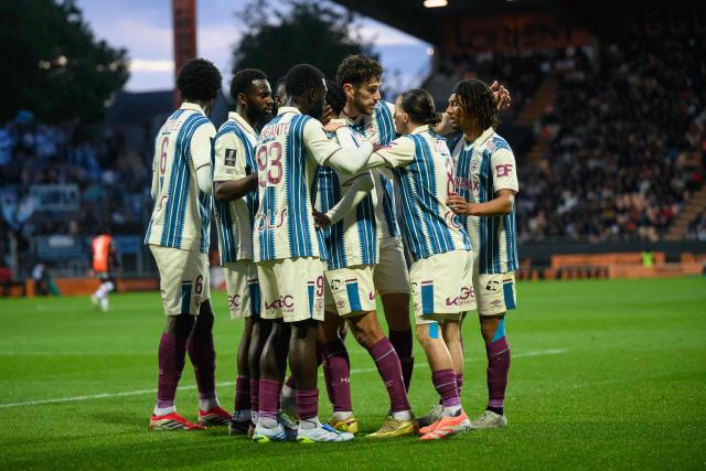 Le Havre's players celebrate their first goal during the French L1 football match between FC Lorient and Le Havre Athletic Club at Yves-Allainmat stadium in Lorient, western France on May 17, 2026. (Photo by Loic VENANCE / AFP)
