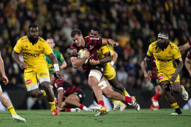 Toulouse's French back row Theo Ntamack runs with the ball during the French Top 14 rugby union match between Stade Rochelais and Stade Toulousain at the Marcel-Deflandre Stadium in La Rochelle, western France, on May 17, 2026. (Photo by XAVIER LEOTY / AFP)