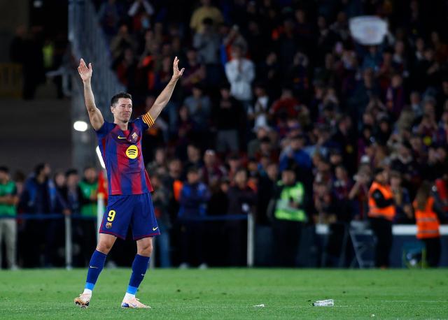 Barcelona's Polish forward #09 Robert Lewandowski waves to fans at the end of the Spanish league football match between FC Barcelona and Real Betis at the Camp Nou Stadium in Barcelona on May 17, 2026. Barcelona striker Robert Lewandowski said yesterday he is leaving the club this summer at the end of his contract. The veteran Polish forward, 37, scored 119 goals for Barcelona in 191 games across all competitions since joining from Bayern Munich in 2022. (Photo by JAIME REINA / AFP)