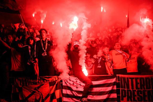 Lorient's supporters hold flares during the French L1 football match between FC Lorient and Le Havre Athletic Club at Yves-Allainmat stadium in Lorient, western France on May 17, 2026. (Photo by Loic VENANCE / AFP)