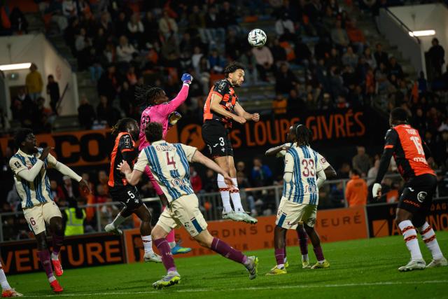 Le Havre's Senegalese goalkeeper #99 Mory Diaw boxes the ball during the French L1 football match between FC Lorient and Le Havre Athletic Club at Yves-Allainmat stadium in Lorient, western France on May 17, 2026. (Photo by Loic VENANCE / AFP)