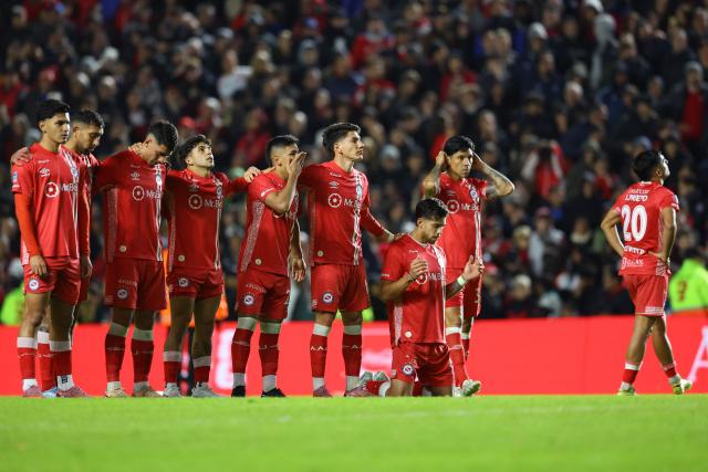 Argentinos Juniors players react during the penalty shoot-out of the Argentine Professional Football League Apertura tournament semifinal match between Argentinos Juniors and Belgrano at the Diego Armando Maradona stadium in Buenos Aires on May 17, 2026. (Photo by Alejandro PAGNI / AFP)