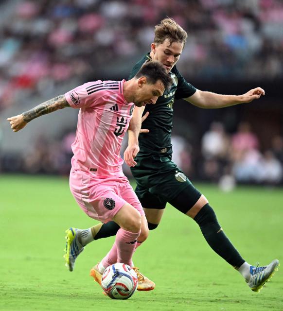 Inter Miami's Argentine forward #10 Lionel Messi (L) controls the ball under pressure from Portland Timber's US defender #23 Ian Smith during a Major League Soccer (MLS) regular season football match between Inter Miami CF and Portland Timbers at Nu Stadium in Miami, Florida, on May 17, 2026. (Photo by CHANDAN KHANNA / AFP)