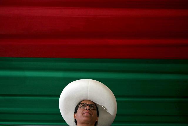 Peru's presidential candidate Roberto Sanchez, of the Juntos por el Peru party, gestures to supporters during a rally in Lima on May 17, 2026. Left-wing candidate Roberto Sanchez has qualified for the runoff of Peru's presidential election and will face right-wing candidate Keiko Fujimori in June 7. (Photo by ERNESTO BENAVIDES / AFP)