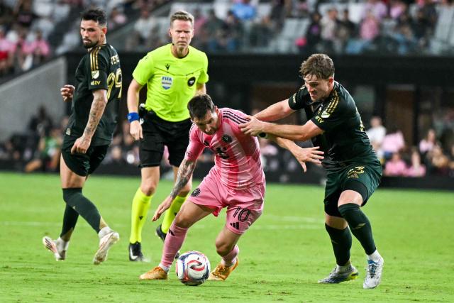 Inter Miami's Argentine forward #10 Lionel Messi (C/R) fights for the ball with Portland Timber's US defender #23 Ian Smith during a Major League Soccer (MLS) regular season football match between Inter Miami CF and Portland Timbers at Nu Stadium in Miami, Florida, on May 17, 2026. (Photo by CHANDAN KHANNA / AFP)