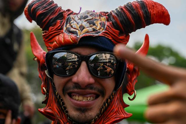 A man attends a Guatemalan freestyle battle in the surroundings of Constitution Square in Guatemala City on May 17, 2026. (Photo by JOHAN ORDONEZ / AFP)