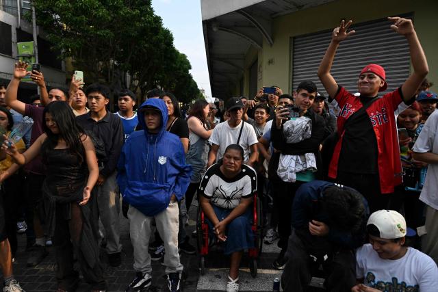 People attend a Guatemalan freestyle battle in the surroundings of Constitution Square in Guatemala City on May 17, 2026. (Photo by JOHAN ORDONEZ / AFP)
