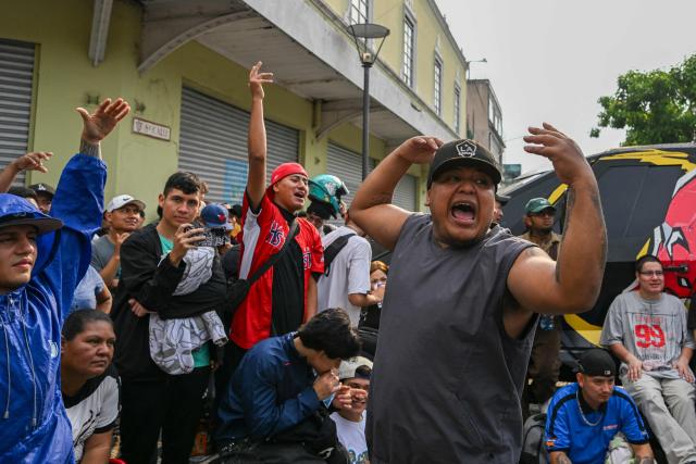 People attend a Guatemalan freestyle battle in the surroundings of Constitution Square in Guatemala City on May 17, 2026. (Photo by JOHAN ORDONEZ / AFP)