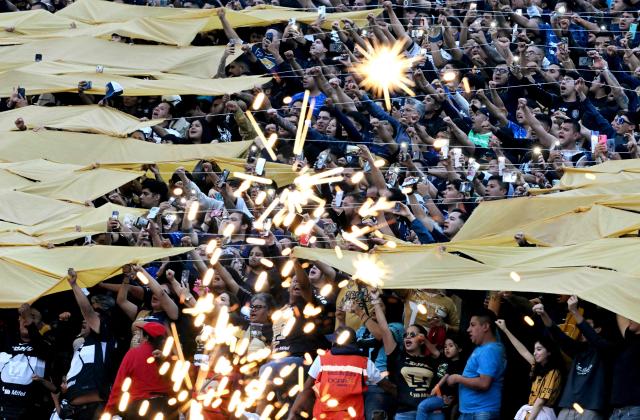 Pumas fans cheer the Liga MX Clausura semifinal second-leg football match between Pumas UNAM and Pachuca at Olimpico Universitario stadium in Mexico City on May 17, 2026. (Photo by YURI CORTEZ / AFP)