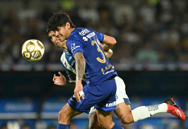 Pumas' Paraguayan forward #31 Robert Morales (front) and Pachuca's midfielder #08 Victor Guzman fight for the ball during the Liga MX Clausura semifinal second-leg football match between Pumas UNAM and Pachuca at Olimpico Universitario stadium in Mexico City on May 17, 2026. (Photo by YURI CORTEZ / AFP)