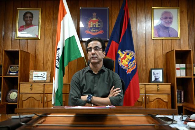 This photograph taken on March 22, 2026 shows Andaman and Nicobar Islands Director General of Police (DGP), Hargobinder Singh Dhaliwal speaking with AFP at his office in Sri Vijaya Puram, the capital city of the Andaman and Nicobar Islands. Outsiders call the Indian Ocean island Little Andaman and its long-isolated guardians the Onge, but those preserving an age-old way of life now under threat have their own names. A $9 billion development plan across India's wider Andaman and Nicobar Islands will affect communities throughout the scattered archipelago. Authorities, treading a delicate line in managing contact, began last year recruiting more than 500 young men from communities across the archipelago as police "homeguards" to help manage relations with outsiders. (Photo by R. Satish BABU / AFP)