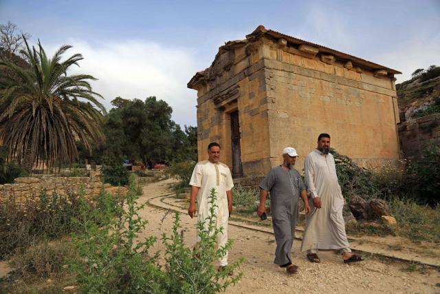 People visit the Sanctuary of Apollo at Cyrene near the ancient historical town of Shahat in the northeastern Mediterranean coast of Libya on May 17, 2026. Libya remains plagued by division and instability after years of unrest following the NATO-backed uprising that toppled longtime leader Muammar Gaddafi in 2011. Libya is still divided between the UN-recognised government in the west and its eastern rival in the east, backed by military commander Khalifa Haftar. (Photo by Abdullah DOMA / AFP)