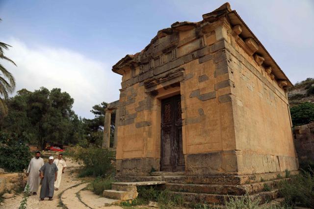 People visit the Sanctuary of Apollo at Cyrene near the ancient historical town of Shahat in the northeastern Mediterranean coast of Libya on May 17, 2026. Libya remains plagued by division and instability after years of unrest following the NATO-backed uprising that toppled longtime leader Muammar Gaddafi in 2011. Libya is still divided between the UN-recognised government in the west and its eastern rival in the east, backed by military commander Khalifa Haftar. (Photo by Abdullah DOMA / AFP)