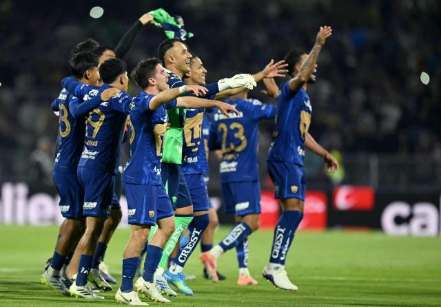 Pumas players celebrate after winning the Liga MX Clausura semifinal second-leg football match between Pumas UNAM and Pachuca at Olimpico Universitario stadium in Mexico City on May 17, 2026. (Photo by YURI CORTEZ / AFP)