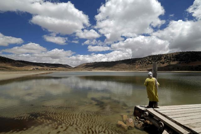 A woman visits the Lake Aguelmame Sidi Ali in the Khenifra province of Morocco on May 17, 2026. (Photo by Abdel Majid BZIOUAT / AFP)