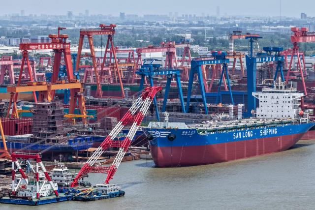 This aerial photo shows a view of ships under construction at a ship building facility in Yangzhou, in China’s eastern Jiangsu province on May 17, 2026. (Photo by CN-STR / AFP) / China OUT