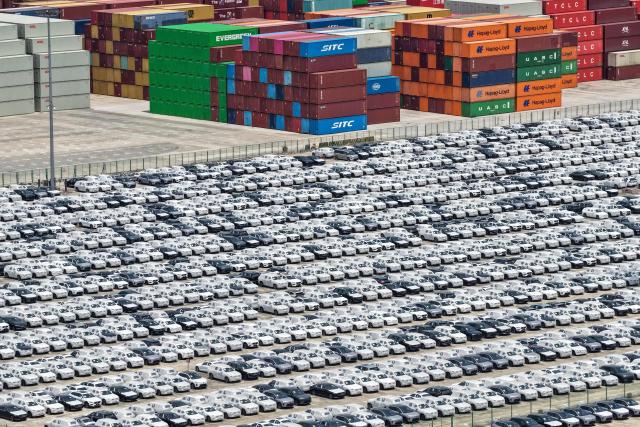 This aerial photo shows Volvo cars at a port in Nanjing, in China’s eastern Jiangsu province on May 17, 2026. (Photo by CN-STR / AFP) / China OUT