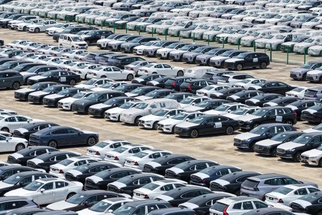 This aerial photo shows Volvo cars at a port in Nanjing, in China’s eastern Jiangsu province on May 17, 2026. (Photo by CN-STR / AFP) / China OUT