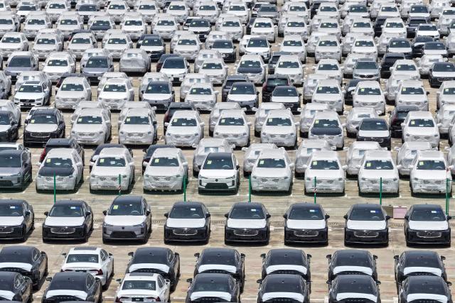 This aerial photo shows Volvo cars at a port in Nanjing, in China’s eastern Jiangsu province on May 17, 2026. (Photo by CN-STR / AFP) / China OUT