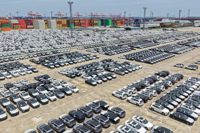 This aerial photo shows Volvo cars at a port in Nanjing, in China’s eastern Jiangsu province on May 17, 2026. (Photo by CN-STR / AFP) / China OUT
