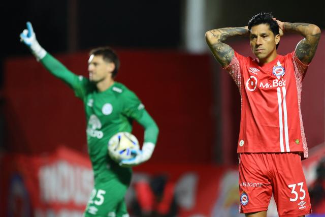 Argentinos Juniors' midfielder #33 Enzo Perez reacts after missing a penalty stopped by Belgrano's Uruguayan goalkeeper #25 Thiago Cardozo during the penalty shoot-out of the Argentine Professional Football League Apertura tournament semifinal match between Argentinos Juniors and Belgrano at the Diego Armando Maradona stadium in Buenos Aires on May 17, 2026. (Photo by Alejandro PAGNI / AFP)