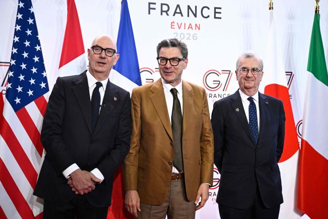 France's Economy, Finances and Industry Minister Roland Lescure (R) and Governor of the Bank of France François Villeroy de Galhau (L) greet Italy's Minister of Economy and Finance Giancarlo Giorgetti prior to a meeting of G7 Finance Ministers and Central Bank Governors in preparation for the summit of heads of State and government to be held in June 2026 in Evian, in Paris on May 18, 2026. (Photo by JULIEN DE ROSA / AFP)