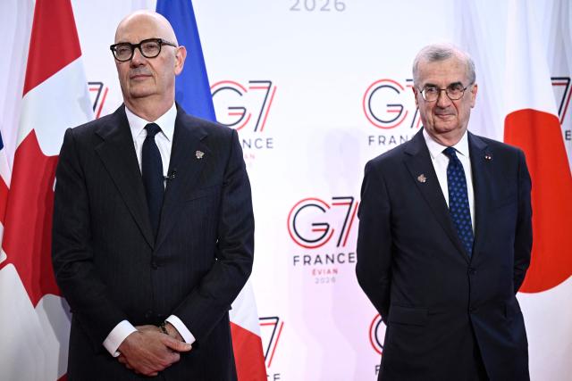 France's Economy, Finances and Industry Minister Roland Lescure and Governor of the Bank of France François Villeroy de Galhau (R) wait for the guests prior to a meeting of G7 Finance Ministers and Central Bank Governors in preparation for the summit of heads of State and government to be held in June 2026 in Evian, in Paris on May 18, 2026. (Photo by JULIEN DE ROSA / AFP)