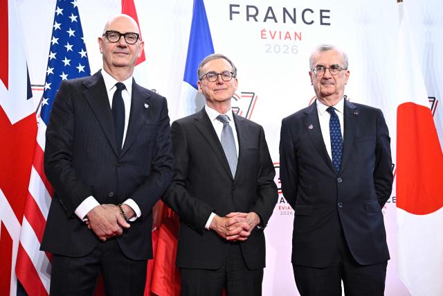 France's Economy, Finances and Industry Minister Roland Lescure (L) and Governor of the Bank of France François Villeroy de Galhau (R) greet Governor of the Bank of Canada Tiff Macklem prior to a meeting of G7 Finance Ministers and Central Bank Governors in preparation for the summit of heads of State and government to be held in June 2026 in Evian, in Paris on May 18, 2026. (Photo by JULIEN DE ROSA / AFP)