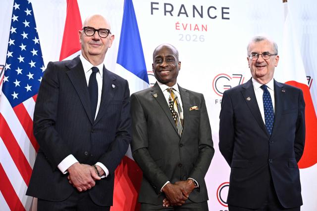 France's Economy, Finances and Industry Minister Roland Lescure (L) and Governor of the Bank of France François Villeroy de Galhau (R) greet US Vice Chair of the Federal Reserve Philip Jefferson prior to a meeting of G7 Finance Ministers and Central Bank Governors in preparation for the summit of heads of State and government to be held in June 2026 in Evian, in Paris on May 18, 2026. (Photo by JULIEN DE ROSA / AFP)