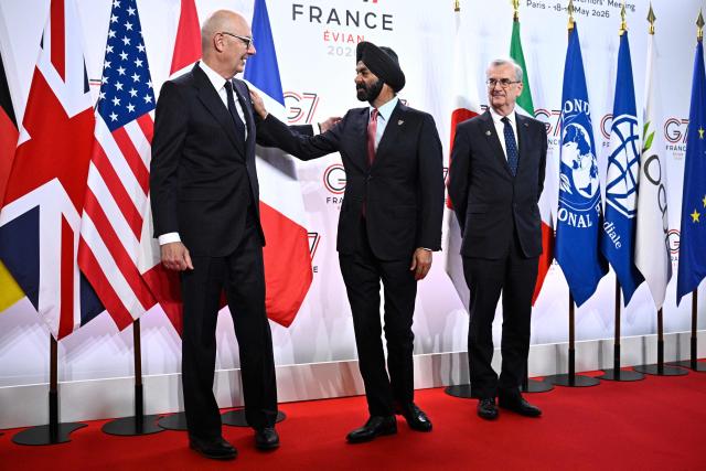 France's Economy, Finances and Industry Minister Roland Lescure (L) and Governor of the Bank of France François Villeroy de Galhau (R) greet President of the World Bank Group Ajay Banga prior to a meeting of G7 Finance Ministers and Central Bank Governors in preparation for the summit of heads of State and government to be held in June 2026 in Evian, in Paris on May 18, 2026. (Photo by JULIEN DE ROSA / AFP)