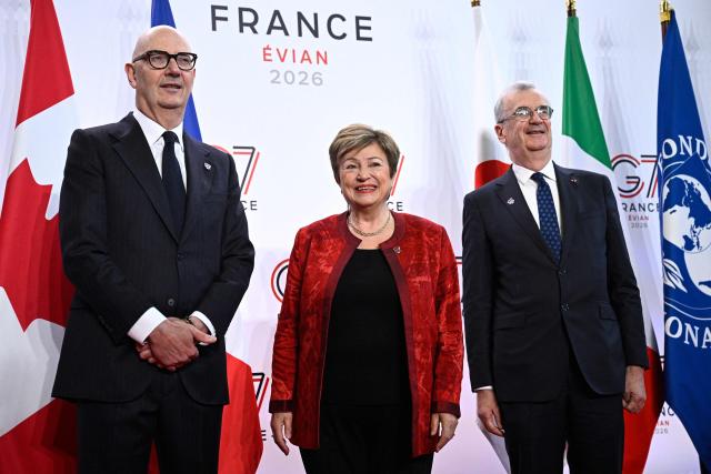 France's Economy, Finances and Industry Minister Roland Lescure (L) and Governor of the Bank of France François Villeroy de Galhau (R) greet Managing Director of the International Monetary Fund Kristalina Georgieva prior to a meeting of G7 Finance Ministers and Central Bank Governors in preparation for the summit of heads of State and government to be held in June 2026 in Evian, in Paris on May 18, 2026. (Photo by JULIEN DE ROSA / AFP)