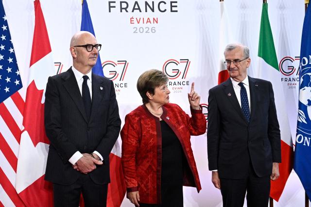 France's Economy, Finances and Industry Minister Roland Lescure (L) and Governor of the Bank of France François Villeroy de Galhau (R) greet Managing Director of the International Monetary Fund Kristalina Georgieva prior to a meeting of G7 Finance Ministers and Central Bank Governors in preparation for the summit of heads of State and government to be held in June 2026 in Evian, in Paris on May 18, 2026. (Photo by JULIEN DE ROSA / AFP)