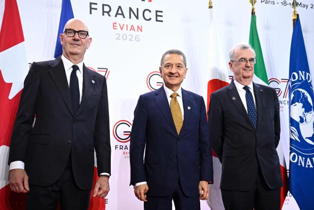 France's Economy, Finances and Industry Minister Roland Lescure (L) and Governor of the Bank of France François Villeroy de Galhau (R) greet Governor of the Bank of Italy Fabio Panetta prior to a meeting of G7 Finance Ministers and Central Bank Governors in preparation for the summit of heads of State and government to be held in June 2026 in Evian, in Paris on May 18, 2026. (Photo by JULIEN DE ROSA / AFP)