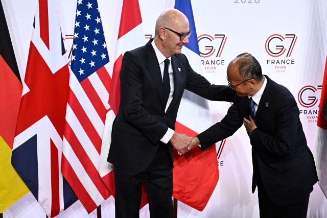 France's Economy, Finances and Industry Minister Roland Lescure (L) greets President of the Asian Development Bank (ADB) Masato Kanda prior to a meeting of G7 Finance Ministers and Central Bank Governors in preparation for the summit of heads of State and government to be held in June 2026 in Evian, in Paris on May 18, 2026. (Photo by JULIEN DE ROSA / AFP)