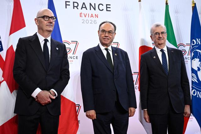 France's Economy, Finances and Industry Minister Roland Lescure (L) and Governor of the Bank of France François Villeroy de Galhau (R) greet Governor of the Bank of England Andrew Bailey prior to a meeting of G7 Finance Ministers and Central Bank Governors in preparation for the summit of heads of State and government to be held in June 2026 in Evian, in Paris on May 18, 2026. (Photo by JULIEN DE ROSA / AFP)