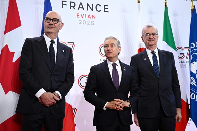 France's Economy, Finances and Industry Minister Roland Lescure (L) and Governor of the Bank of France François Villeroy de Galhau (R) greet Canada's Minister of Finance François-Philippe Champagne prior to a meeting of G7 Finance Ministers and Central Bank Governors in preparation for the summit of heads of State and government to be held in June 2026 in Evian, in Paris on May 18, 2026. (Photo by JULIEN DE ROSA / AFP)