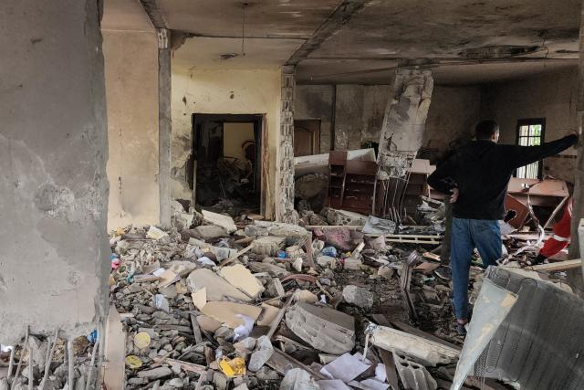 A man checks the damages following an Israeli strike on an apartment building in Baalbek on May 18, 2026. An Israeli missile strike on an apartment in eastern Lebanon on May 17 killed an Islamic Jihad commander and his 17-year-old daughter, Lebanese state media said. (Photo by AFP)