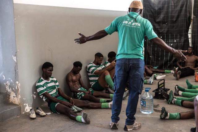 Sporting Clube da Praia players listen as their head coach speaks during half-time of the Praia Cup final football match between Desportivo da Praia and Sporting Clube da Praia at the Estadio da Varzea in Praia, on April 4, 2026. Both teams played the final for a chance to qualify for the Cape Verdean Cup, a knockout tournament that brings together the champions of each island. 
This archipelago of 10 islands is the smallest African nation ever to qualify for a World Cup with a population of just 550,000. 
The national team, known as the Blue Sharks, will compete in Group H against Spain, Saudi Arabia, and Uruguay. 
Their World Cup qualification has inspired many players in the local leagues, who now dream of joining the national team and representing their country. (Photo by PATRICK MEINHARDT / AFP)