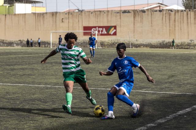 Desportivo da Praia and Sporting Clube da Praia players fight for the ball during the Praia Cup final football match between Desportivo da Praia and Sporting Clube da Praia at the Estadio da Varzea in Praia, on April 4, 2026. Both teams played the final for a chance to qualify for the Cape Verdean Cup, a knockout tournament that brings together the champions of each island. 
This archipelago of 10 islands is the smallest African nation ever to qualify for a World Cup with a population of just 550,000. 
The national team, known as the Blue Sharks, will compete in Group H against Spain, Saudi Arabia, and Uruguay. 
Their World Cup qualification has inspired many players in the local leagues, who now dream of joining the national team and representing their country. (Photo by PATRICK MEINHARDT / AFP)