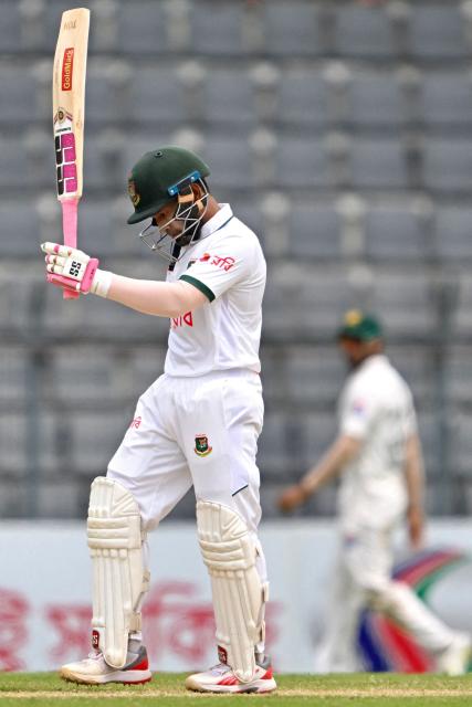 Bangladesh’s Mushfiqur Rahim celebrates after scoring a half-century (50 runs) during the third day of the second Test cricket match between Bangladesh and Pakistan at the Sylhet International Cricket Stadium in Sylhet on May 18, 2026. (Photo by Munir UZ ZAMAN / AFP)