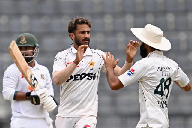 Pakistan's Hasan Ali (C) celebrates with Amad Butt (R) after taking the wicket of Bangladesh's Litton Das during the third day of the second Test cricket match between Bangladesh and Pakistan at the Sylhet International Cricket Stadium in Sylhet on May 18, 2026. (Photo by Munir UZ ZAMAN / AFP)