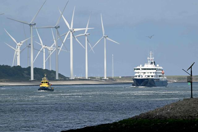 The Dutch Hantavirus-hit cruise ship MV Hondius sails off the Netherlands' coast as it approaches the port of Rotterdam on May 18, 2026. Cruise ship MV Hondius is expected to arrive at the port of Rotterdam and the ship's crew members will undergo a medical screening. (Photo by NICOLAS TUCAT / AFP)