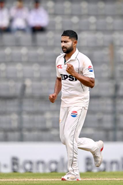 Pakistan’s Khurram Shahzad celebrates after taking the wicket of Bangladesh’s Mehidy Hasan Miraz during the third day of the second Test cricket match between Bangladesh and Pakistan at the Sylhet International Cricket Stadium in Sylhet on May 18, 2026. (Photo by Munir UZ ZAMAN / AFP)
