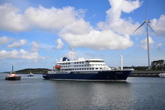 The Dutch Hantavirus-hit cruise ship MV Hondius sails off the Netherlands' coast as it approaches the port of Rotterdam on May 18, 2026. Cruise ship MV Hondius is expected to arrive at the port of Rotterdam and the ship's crew members will undergo a medical screening. (Photo by JOHN THYS / AFP)